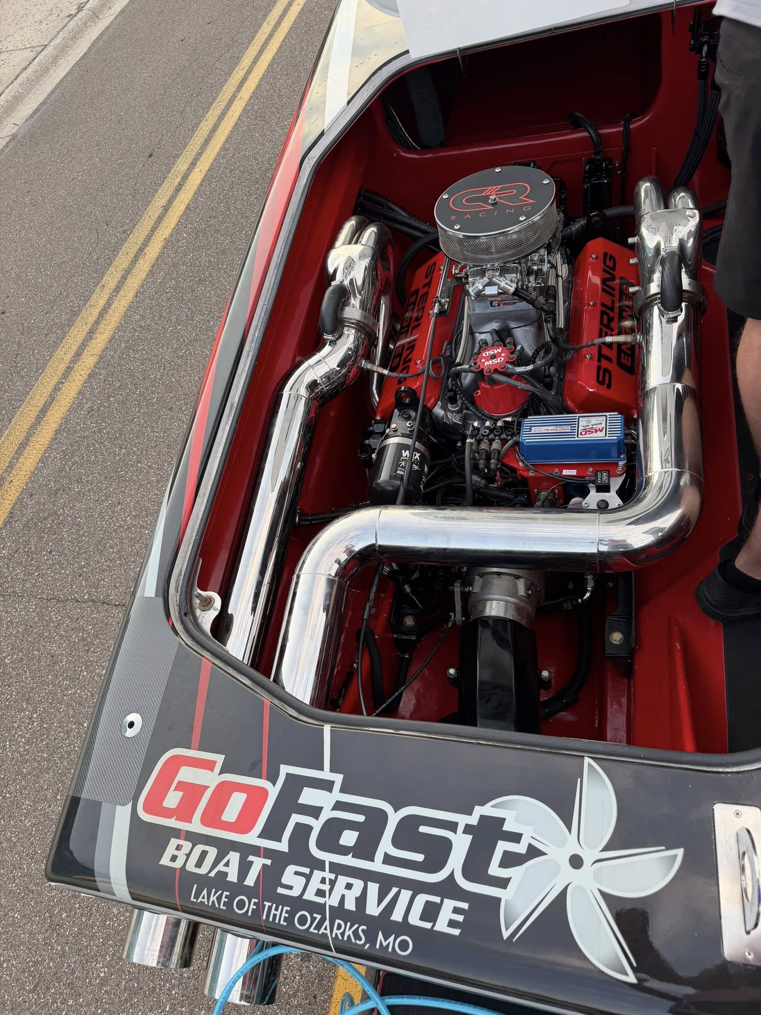 Red marine engine in a performance boat engine bay