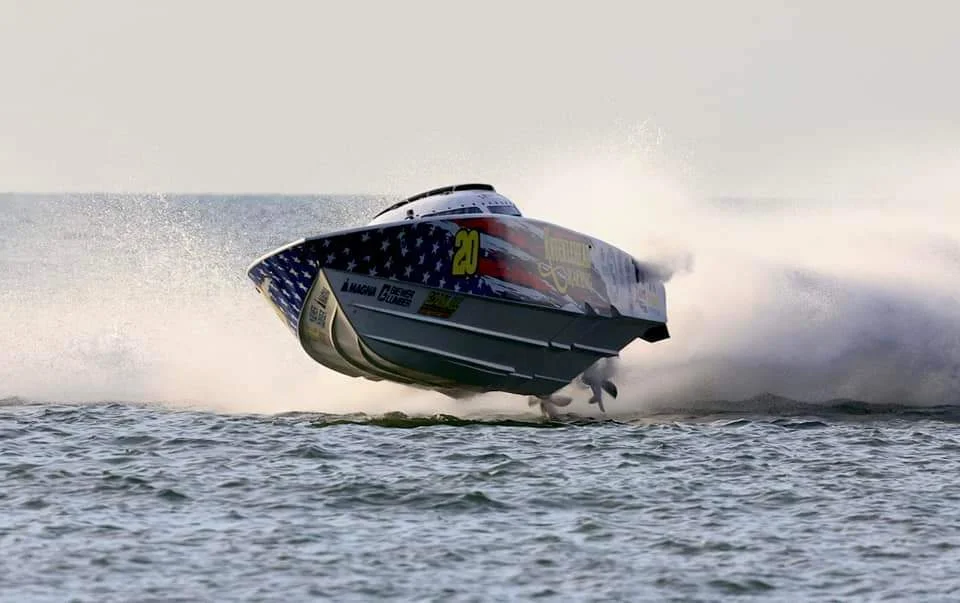 Sterling-powered offshore race boat at speed on the water